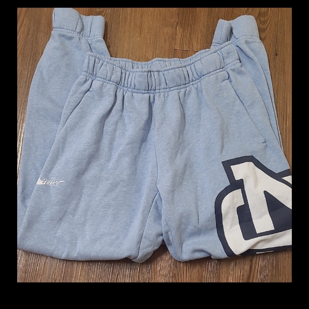 Nike wome,s Light Blue Joggers with Navy Logo used good condition